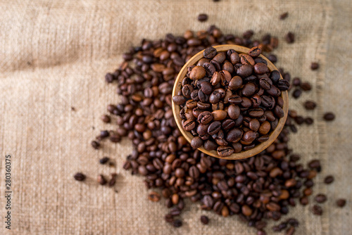 coffee beans on burlap sack © Александр Захаров