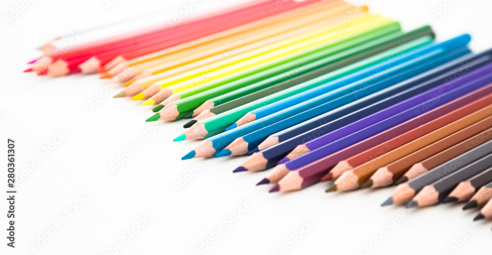colored pencils lying in irregular row
