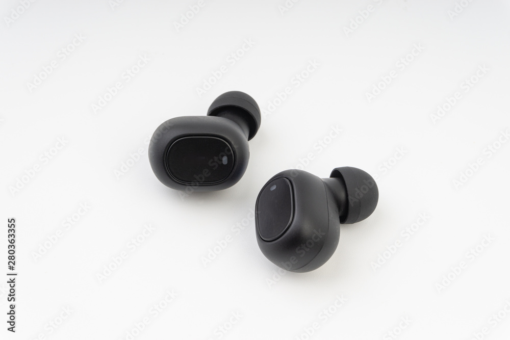 Wireless earbuds or earphones on white background Wireless earbuds or earphones on white background