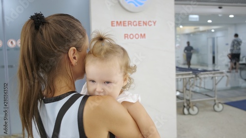 Wallpaper Mural Mom and child come in in the emergency room at the hospital in Pattaya Thailand. Torontodigital.ca