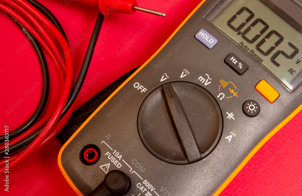 Electrical digital multimeter. Electric measurement tool. Tester