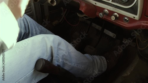 Man Driving Vintage Pickup Truck. Side View. Close Up.