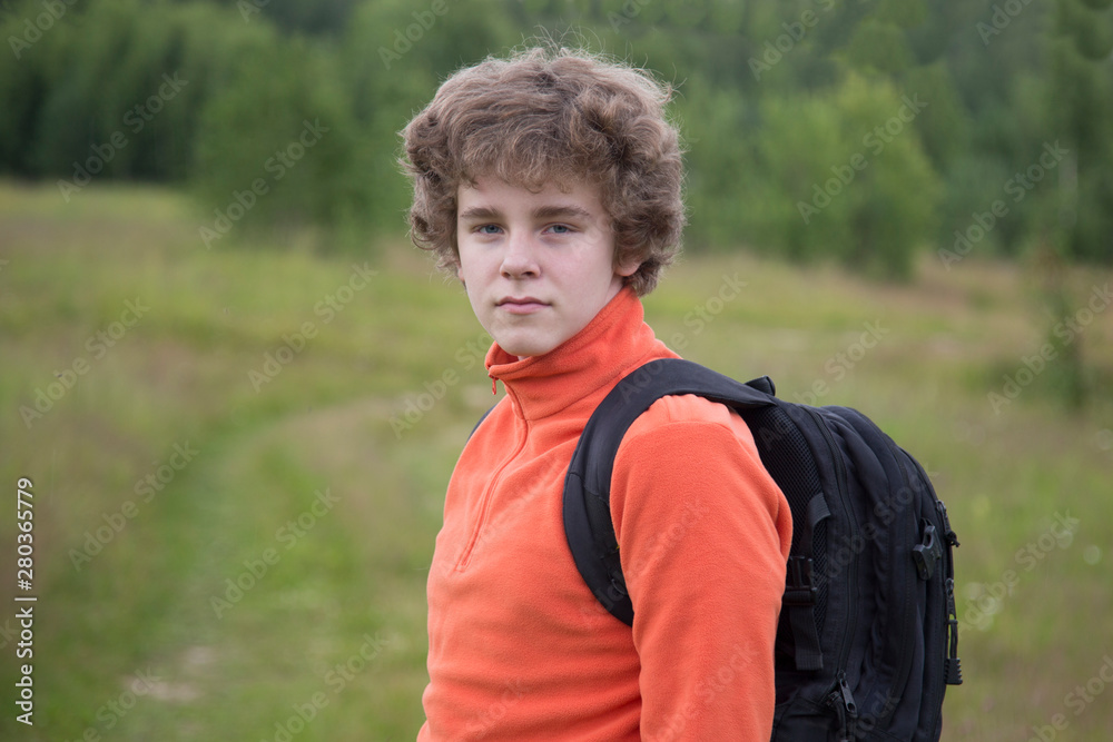 Schoolboy teen goes to school with a satchel. Schoolboy teen goes to school with a satchel.