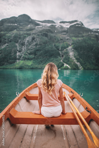 young woman in boat in Lovatnet © Mathilda