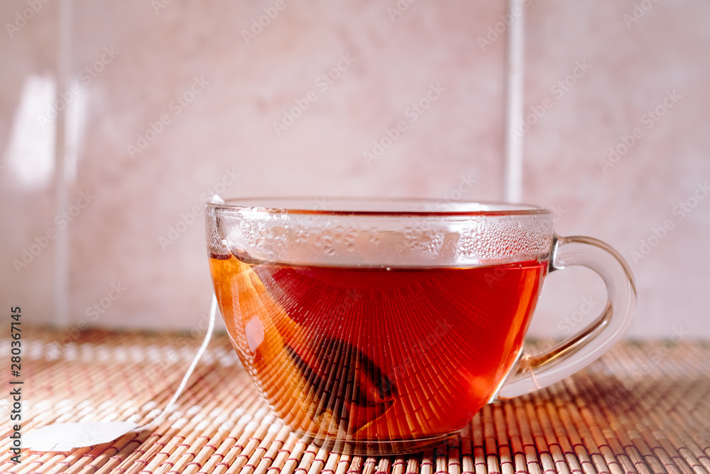 Fototapeta premium tea in a clear glass black