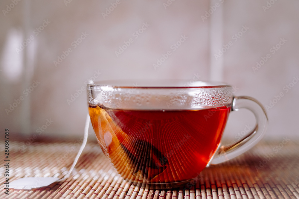 Fototapeta premium tea in a clear glass black