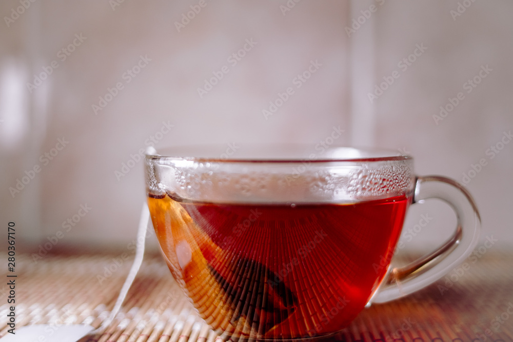 Fototapeta premium tea in a clear glass black