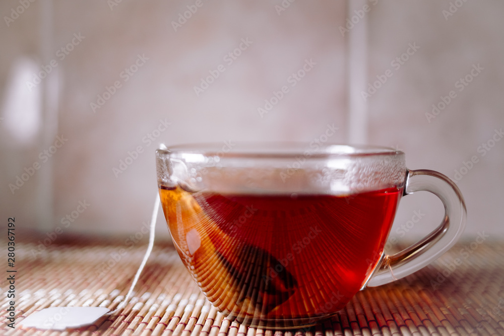 Fototapeta premium tea in a clear glass black