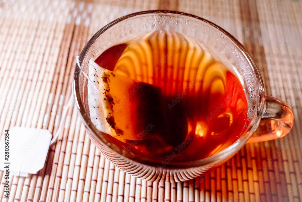 Fototapeta premium tea in a clear glass black