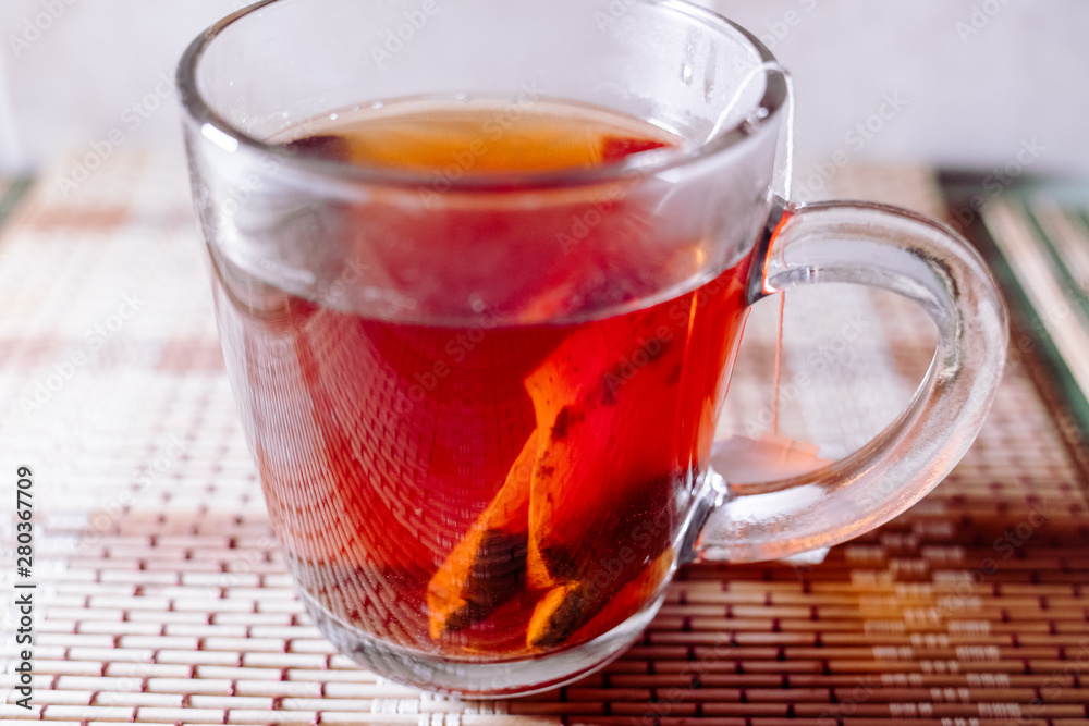 Fototapeta premium tea in a clear glass black