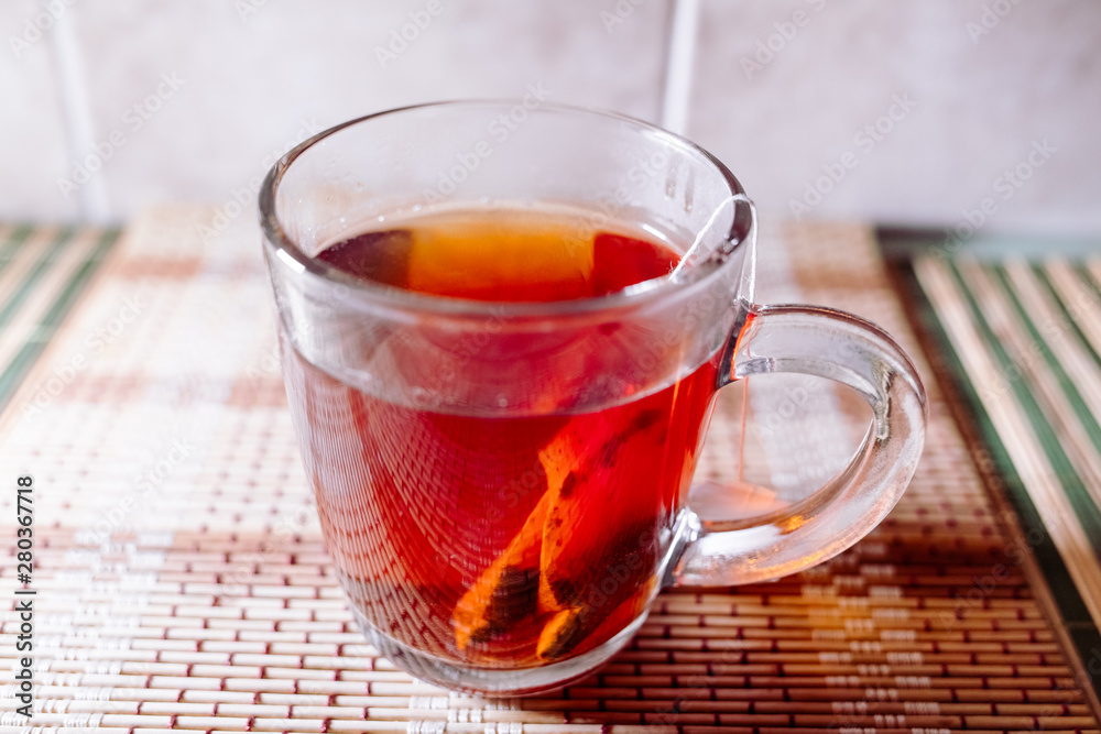 Fototapeta premium tea in a clear glass black