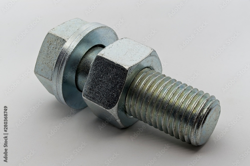 Steel nut, bolt and washers on white background Steel nut, bolt and washers on white background