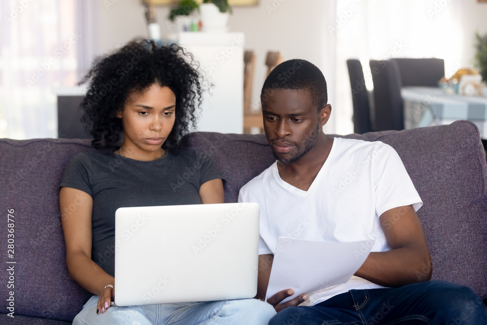 Worried african couple received unpleasant notice letter about debt