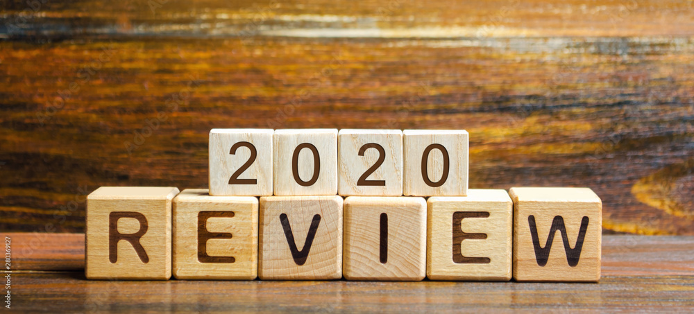 Wooden blocks with the word Review 2020. Business concept. Feedback, Progress. New trends and prospects. Financial performance indicator. Results of the year. Financial and economic activities. Audit.