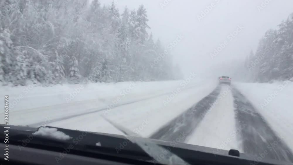 winter roadl in heavy snow with strong blizzard in moving car winter roadl in heavy snow with strong blizzard in moving car
