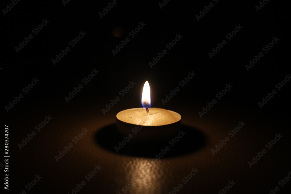 burning candle tablet in the dark burning candle tablet in the dark