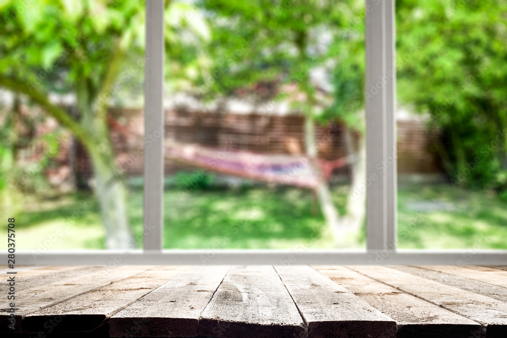 Table background and spring time. Green nature in blurred view in distance. Empty space for decoration and an advertising product. Table background and spring time. Green nature in blurred view in distance. Empty space for decoration and an advertising product.