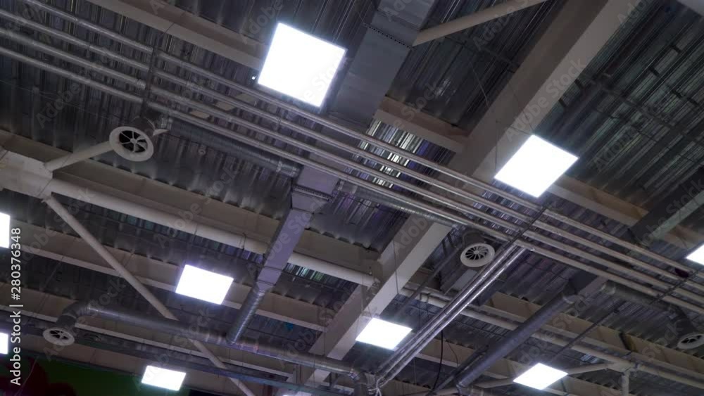 ceiling of big industrial building with air duct ventilation pipes ceiling of big industrial building with air duct ventilation pipes