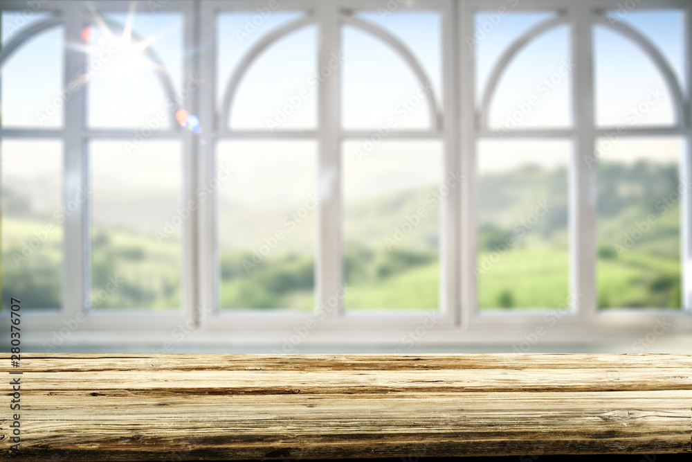 Table background and spring time. Green nature in blurred view in distance. Empty space for decoration and an advertising product. Table background and spring time. Green nature in blurred view in distance. Empty space for decoration and an advertising product.