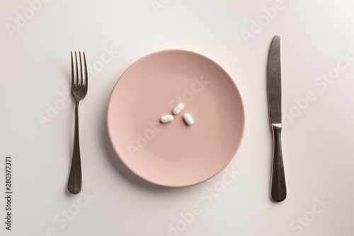 Foto Pills on a plate. Flat lay.