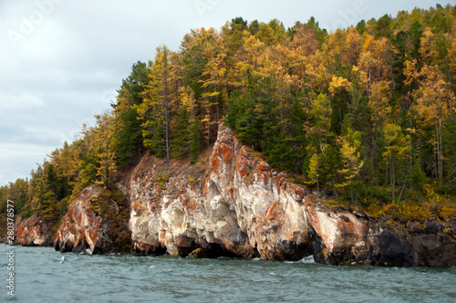 Lake Baikal Russia, headland with autumn colors on Chivyrkuysky Bay photo