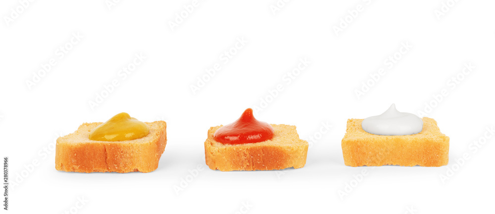 sandwiches with sauces on a white background, small pieces of bread with tomato, ketchup, mustard, mayonnaise and greens. Set