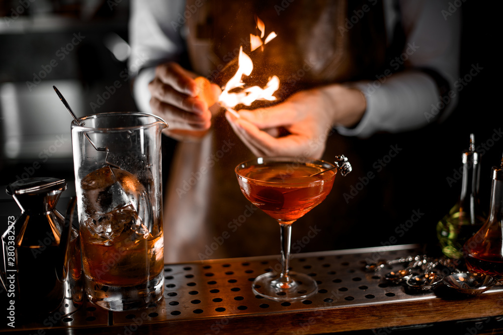 Close-up of bartender firing up a match Close-up of bartender firing up a match