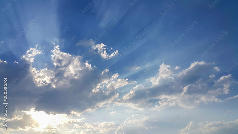 beautiful background of clouds, clearly visible lines of white clouds and blue sky, the top is a sunbeam beautiful background of clouds, clearly visible lines of white clouds and blue sky, the top is a sunbeam