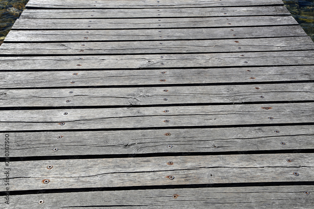 Obraz premium Decorative background of old wooden bridge floor