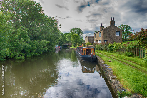 Narrowboat on a British canal in rural setting Fototapeta