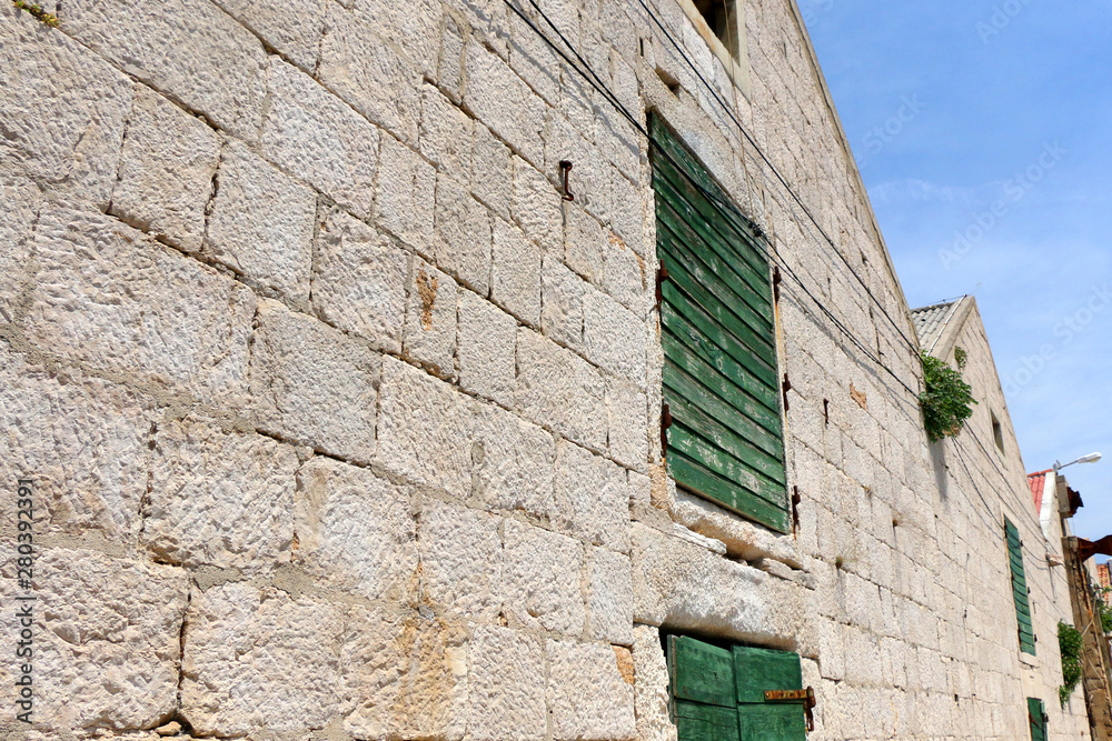 Rustic detail of historic salt warehouse in town Pag, on island Pag, Croatia.