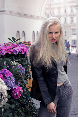 Beautiful girl walking around the city in the afternoon