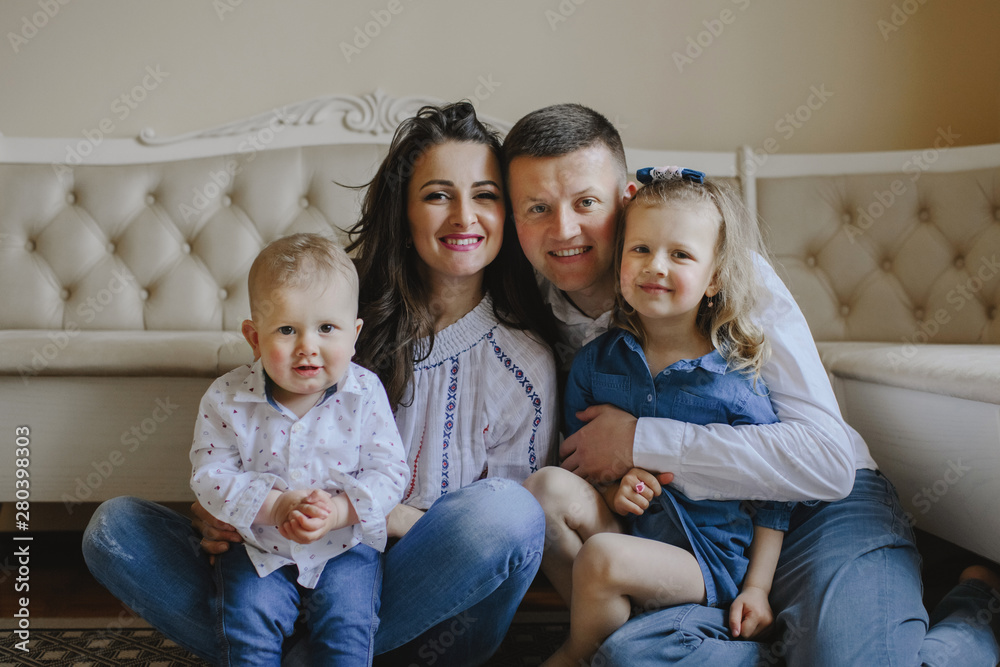 Happy smiling family with children