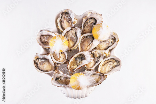 Mediterranean dish, European cuisine. Fresh raw mussels served with lemon, and assorted sauces- oyster, soy, creamy, mustard, red chili pepper sauce