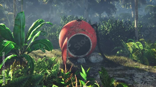 Wrecked space capsule lies in the jungle in the middle of palm trees and tropical vegetation photo