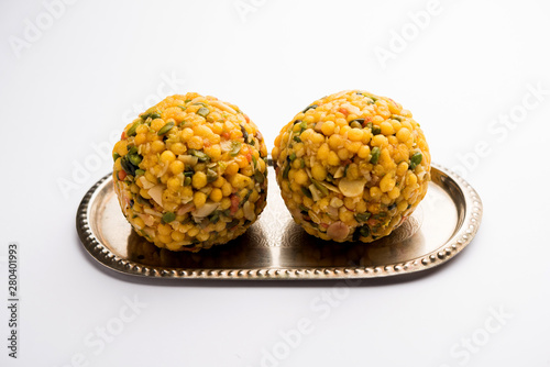 Jumbo Boondi Laddu mixed with dry fruits also know as laddoo/ ladoo/ laddo or Sweet dumplings made during festivals or weddings photo