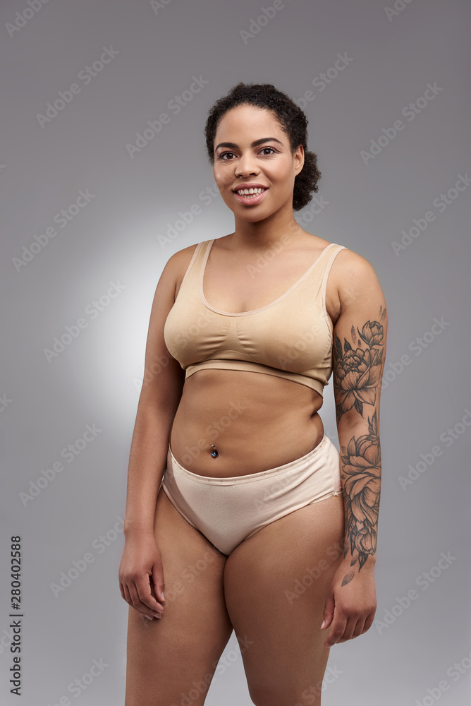 Fat smiling Afro American woman posing for camera Fat smiling Afro American woman posing for camera
