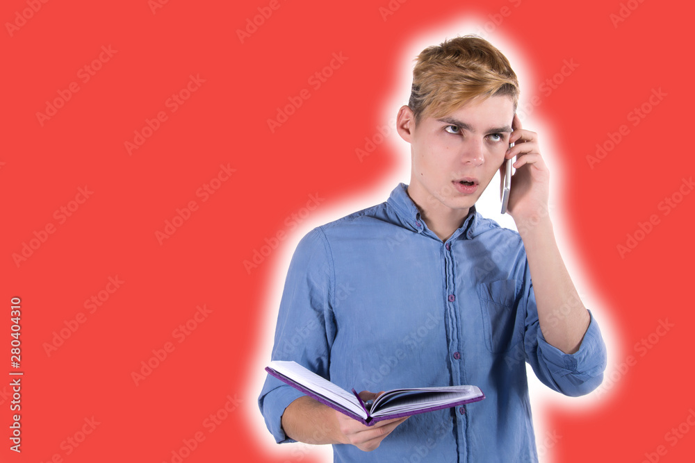 Young attractive student talking on the phone. Young attractive student talking on the phone.