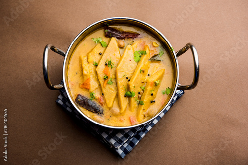 Dal Dhokli, Varan Phal or Chakolya is a gujarati, Rajasthani and maharashtrian dish made using diamond shape wheat flour cakes boiled in a dal. It's an easy one pot meal. served in a bowl. photo