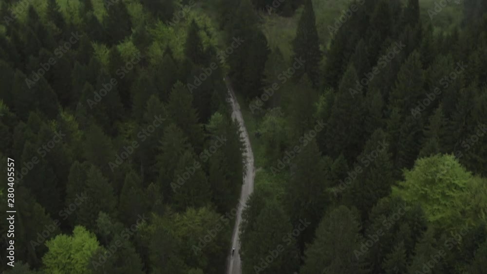 Aerial dron shot of mountain bikes on a road
