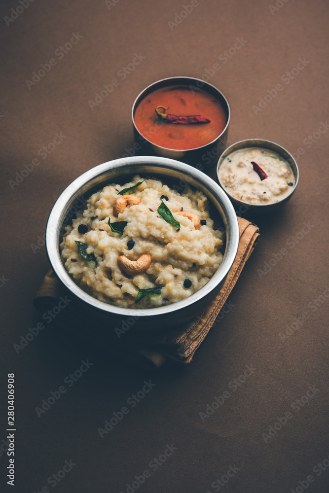 Ven pongal recipe is a popular South Indian food prepared with rice & moong dal and served with sambar and coconut chutney, selective focus Ven pongal recipe is a popular South Indian food prepared with rice & moong dal and served with sambar and coconut chutney, selective focus