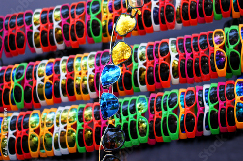 View of cheap plastic eye glasses or goggles or sun glasses display in retail market display