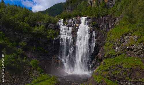 Frontal view of the Skjervsfossen in summer  seen from the base. Norway.