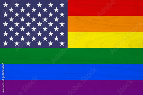 A USA pride flag on with wood texture