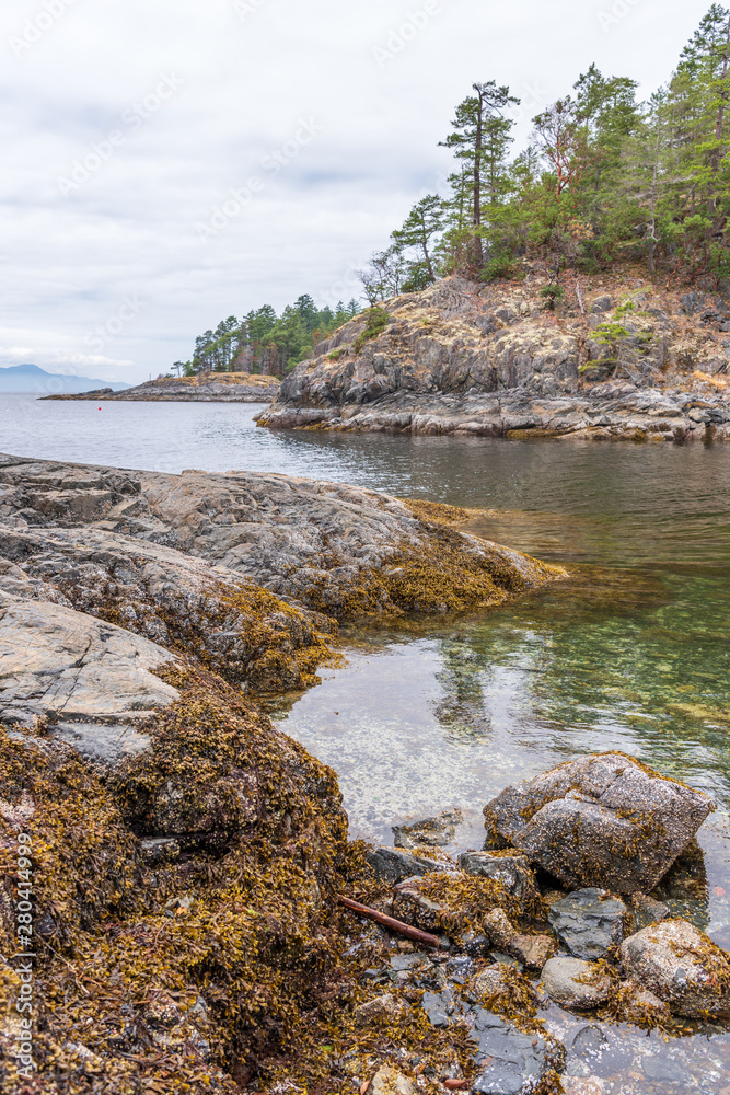 View over Inlet, ocean and island with rocks and mountains in beautiful British Columbia. Canada. View over Inlet, ocean and island with rocks and mountains in beautiful British Columbia. Canada.