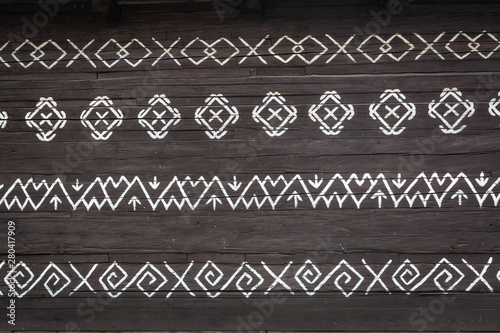 Obraz na płótnie Old wooden houses in Slovakia UNESCO village Cicmany. The ornaments from Cicmany, and the Slovak folk pattern. w salonie