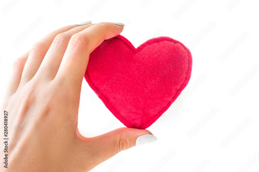 Red heart in female hands isolated on white background. Love concept Red heart in female hands isolated on white background. Love concept