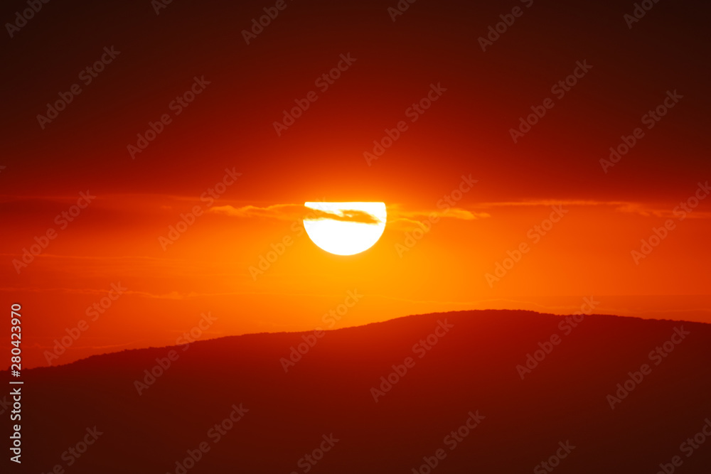 Beautiful sunset sky above clouds with dramatic light. Beautiful sunset sky above clouds with dramatic light.