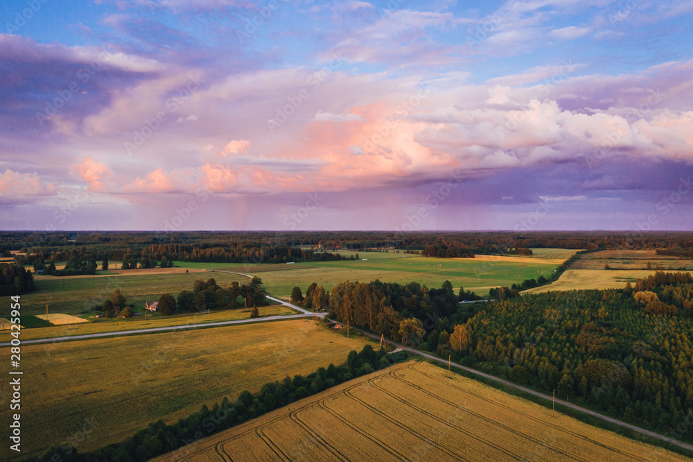 Fototapeta premium Beautiful storm cloud formation over rural country are in summer sunset