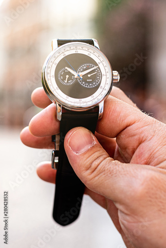 unrecognizable man with watch on wrist